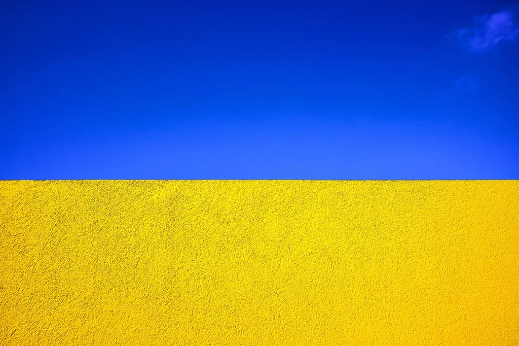 blue sky against yellow wall