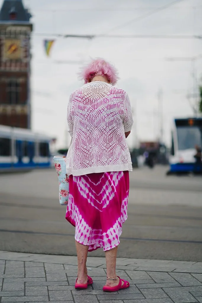 Woman wearing all pink facing away from the camera