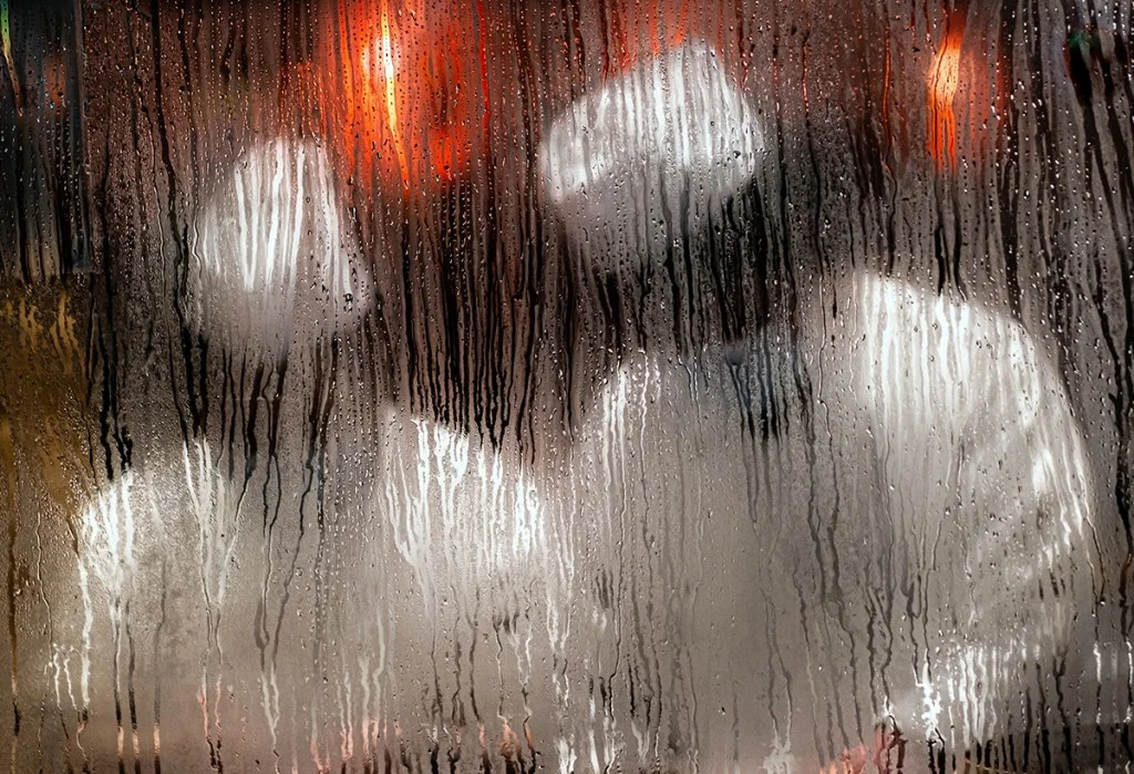 Two people through a steamed-up window