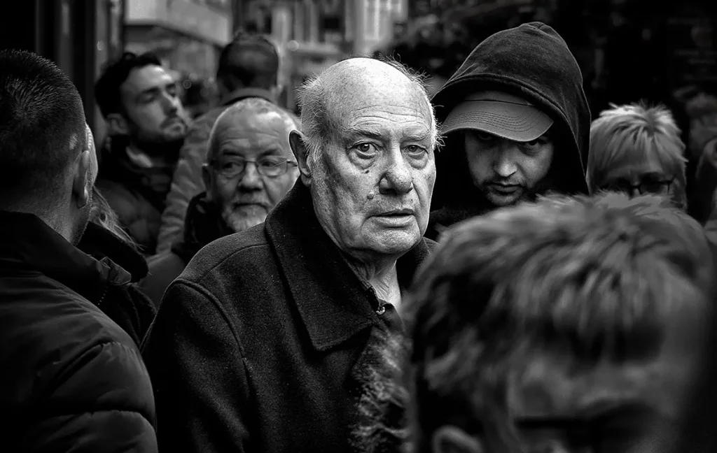 Portrait of a man in the crowd of York Christmas market