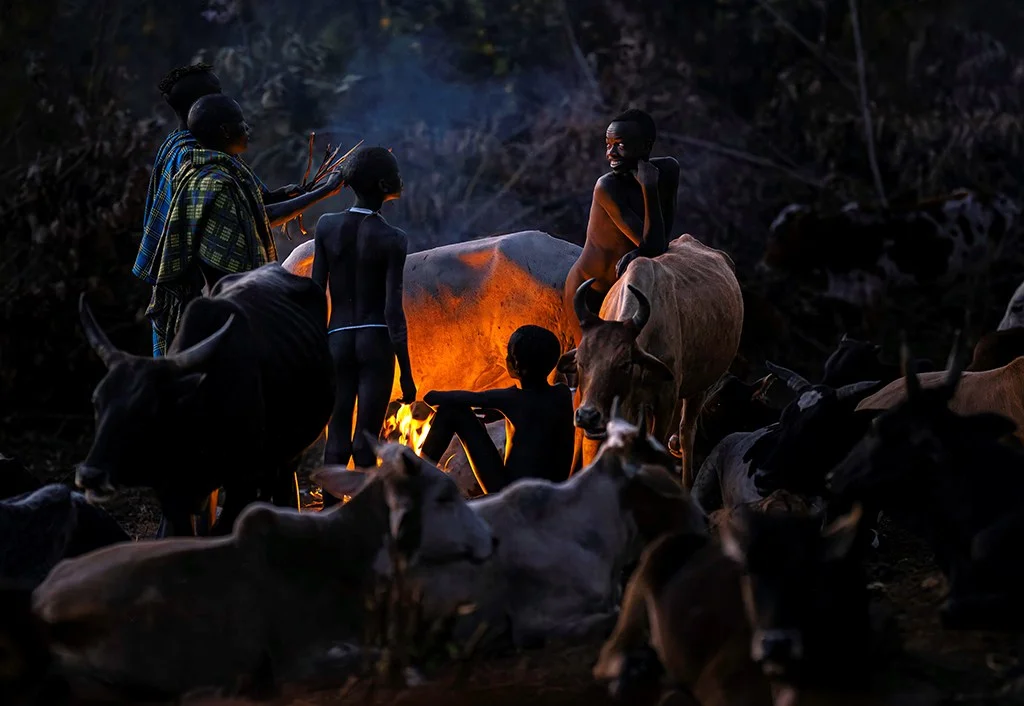 Kids around a fire at night