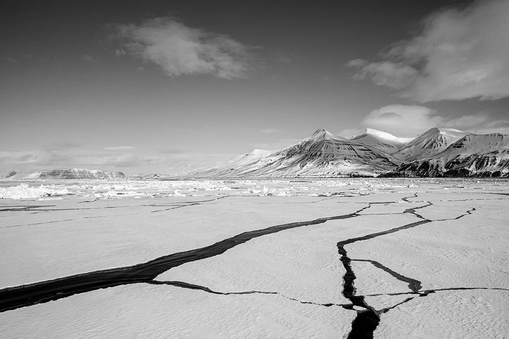 cracks of ice in svalbard landscape