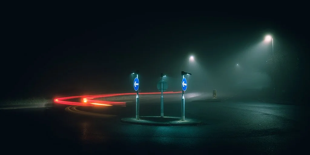 traffic trail at night around roundabout