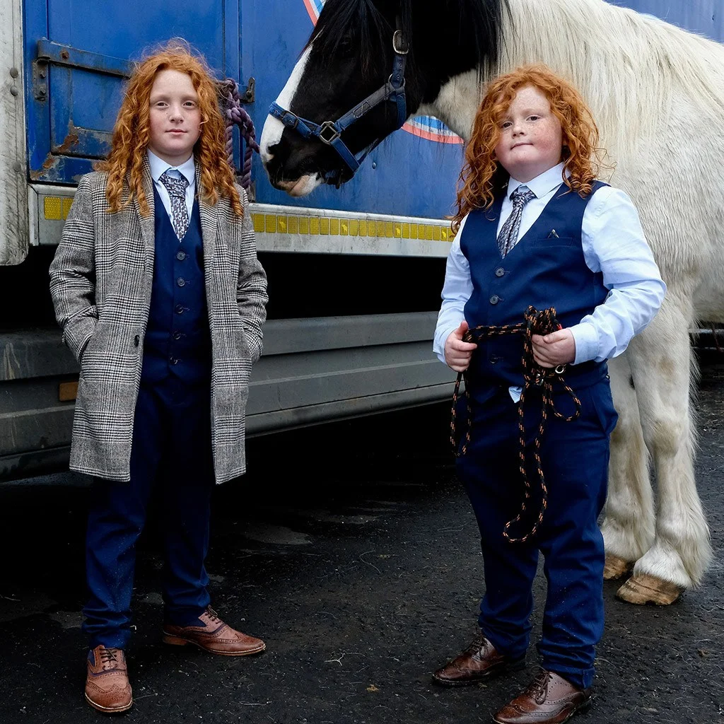 Portrait of twin boys with flame-red curls