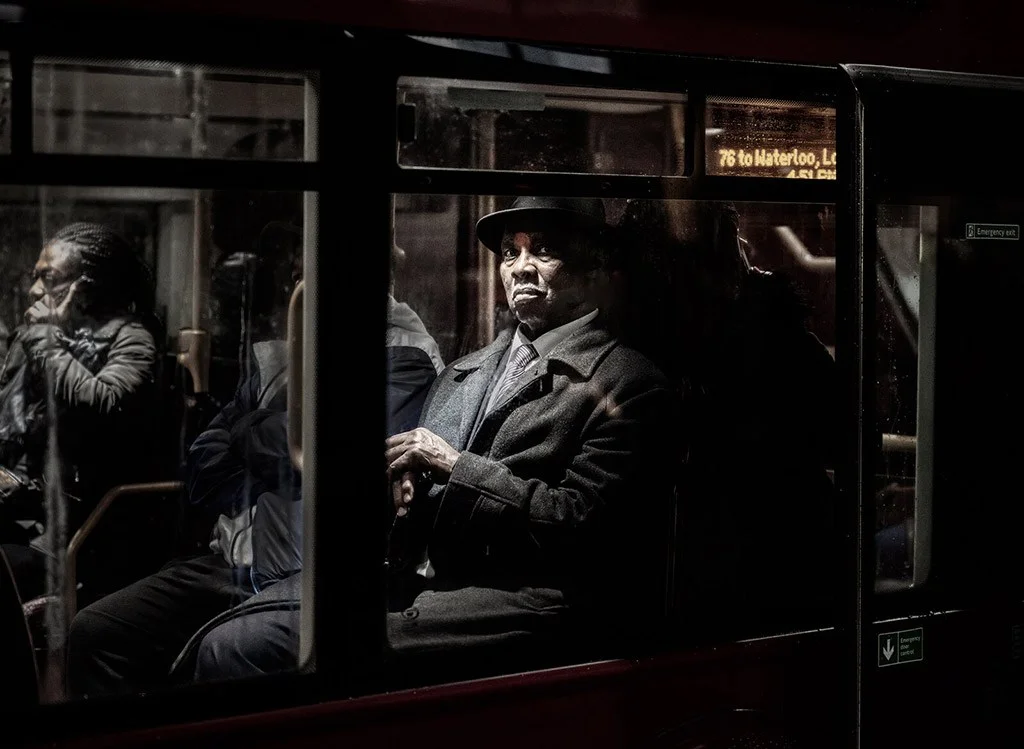 canid man on a bus capturing moment of distance and contemplation